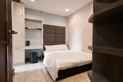 Cozy modern bedroom with stylish decor and ample storage space