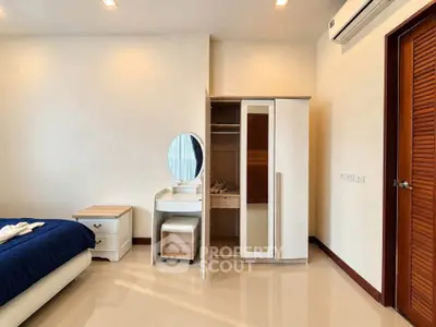 Modern bedroom with sleek furniture and air conditioning in a stylish apartment.