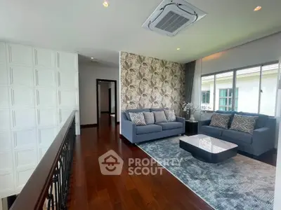 Luxurious living room with elegant decor and natural light, featuring plush sofas and a stylish coffee table.
