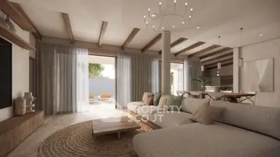 Spacious living room with modern decor and natural light, featuring a cozy sectional sofa and elegant chandelier.