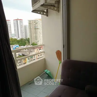 Cozy balcony with city view, perfect for relaxation and enjoying the skyline.