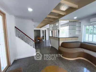 Spacious modern living room with stylish furniture and open layout