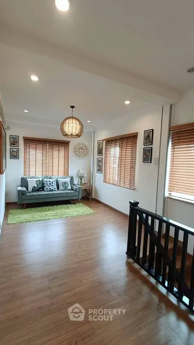 Spacious living room with wooden flooring and stylish decor