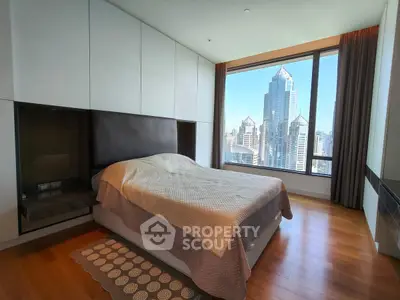 Luxurious bedroom with stunning city view in modern high-rise apartment
