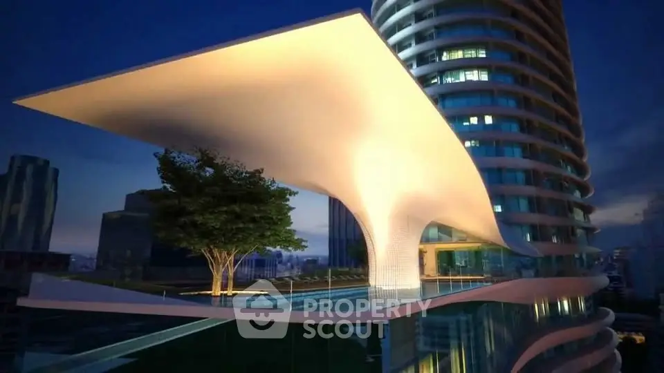 Stunning modern architectural building with unique curved design and illuminated rooftop terrace.