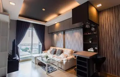 Modern living room with stylish decor and balcony view