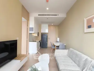 Modern living room with open kitchen and stylish decor