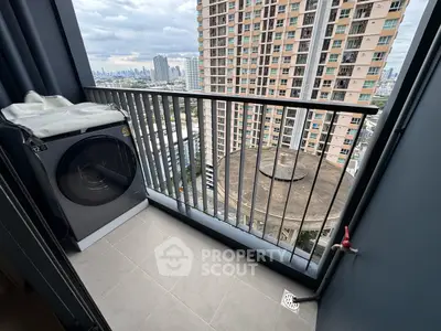 High-rise balcony with washing machine and city view