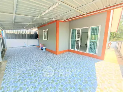 Spacious tiled balcony with modern exterior design and ample natural light.