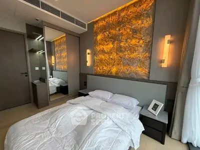 Luxurious bedroom with modern lighting and elegant decor
