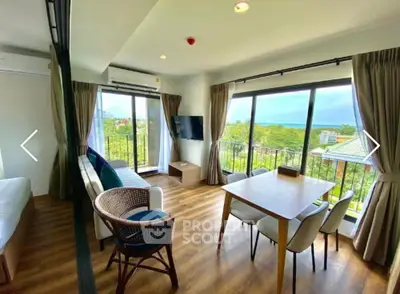 Spacious living room with panoramic windows and stunning view