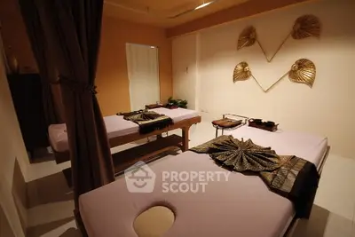 Luxurious spa room with massage tables and elegant decor, perfect for relaxation and rejuvenation.
