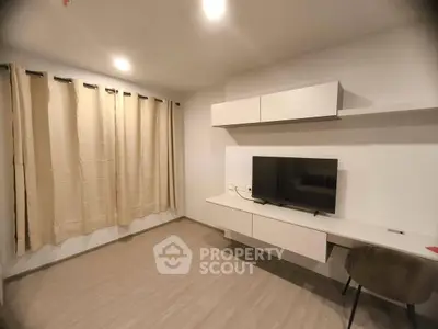 Modern living room with sleek TV setup and stylish furniture