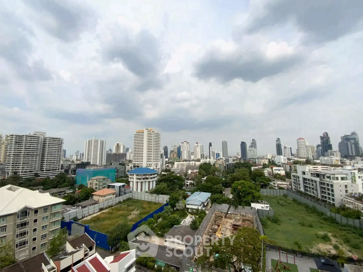 Stunning cityscape view with lush greenery and modern skyline, perfect for urban living enthusiasts.
