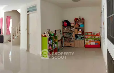 Spacious living area with glossy floors and ample storage, perfect for family living.
