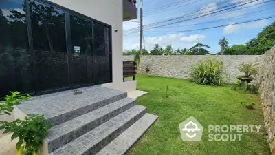 Charming garden view with modern patio steps and lush greenery