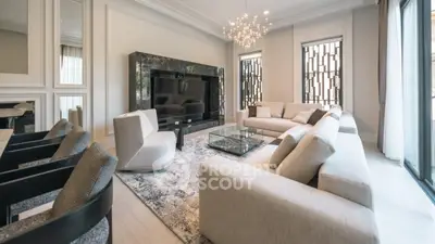 Luxurious modern living room with elegant decor and spacious seating area.