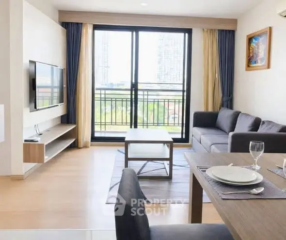 Modern living room with balcony view and stylish furniture