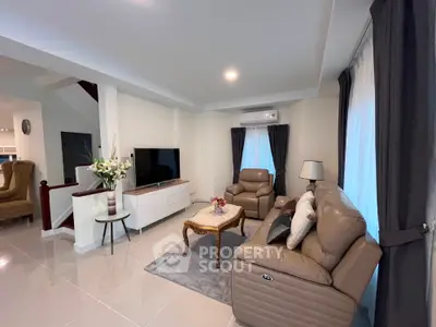 Spacious modern living room with leather sofas and elegant decor