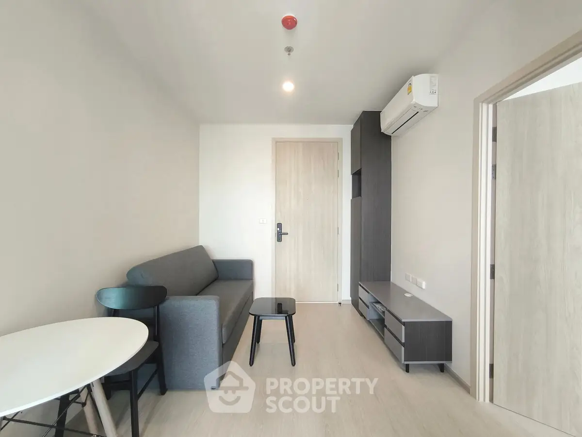 Modern living room with minimalist furniture and air conditioning