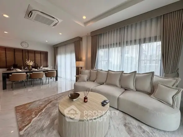 Luxurious open living room with elegant dining area and modern decor