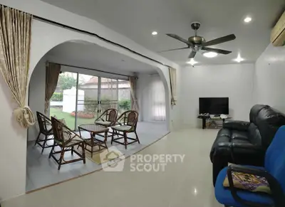 Spacious living room with modern furniture and garden view