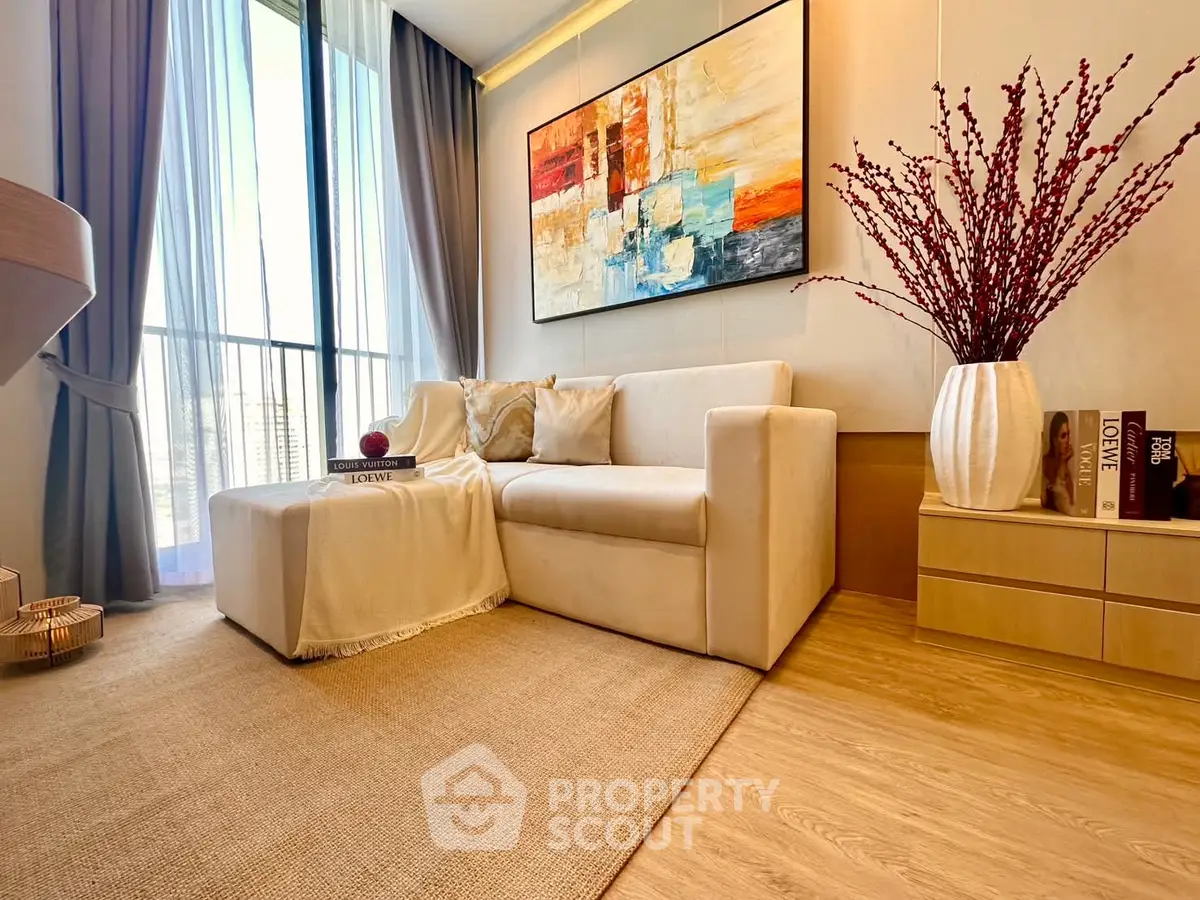 Elegant living room with modern decor and large window view