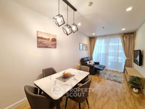 Modern living room with elegant dining area and natural light