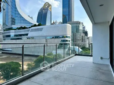 Spacious balcony with stunning cityscape views in a modern urban setting.