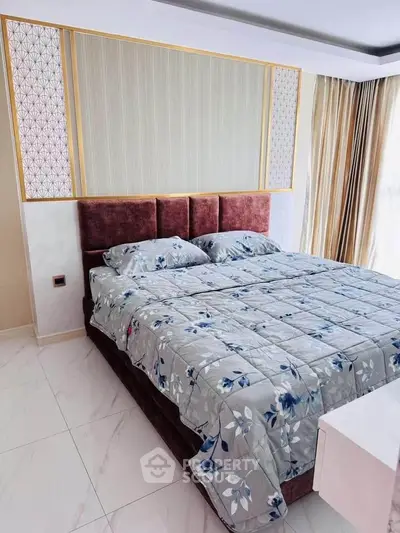 Luxurious bedroom with elegant decor and large windows for natural light.