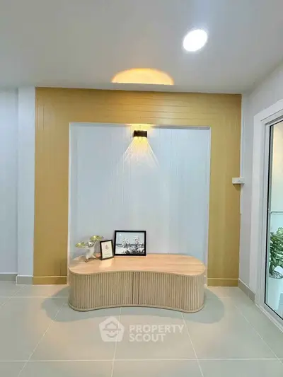 Modern interior with stylish wooden bench and decorative wall lighting