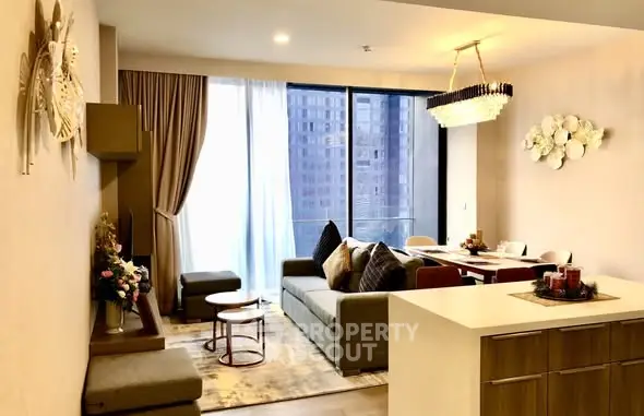 Modern living room with elegant decor and large windows offering city views