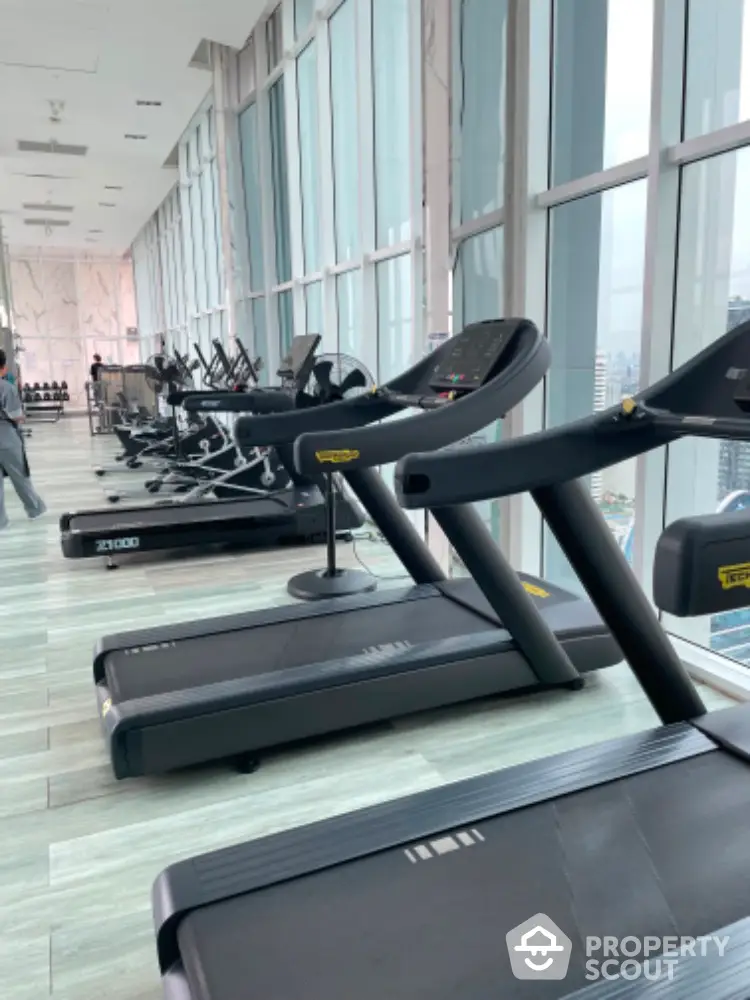 Modern gym with panoramic city views and state-of-the-art equipment