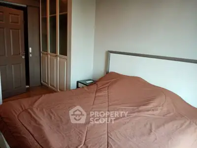 Cozy bedroom with wooden wardrobe and modern decor