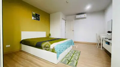 Modern bedroom with stylish decor and air conditioning in a cozy apartment.