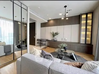 Modern living room with elegant decor and large windows