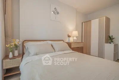 Cozy bedroom with modern decor and soft lighting, featuring a comfortable bed and stylish wardrobe.