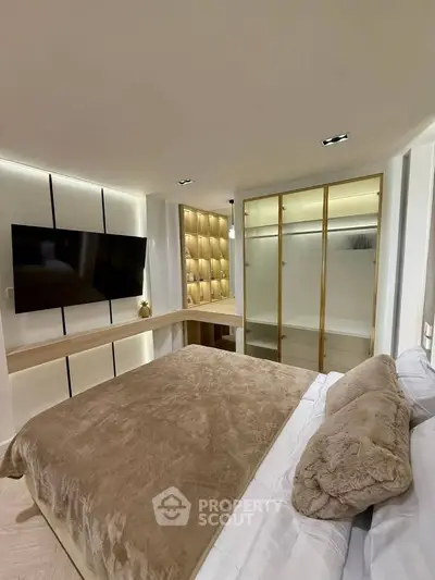 Luxurious modern bedroom with plush bedding and sleek built-in wardrobe