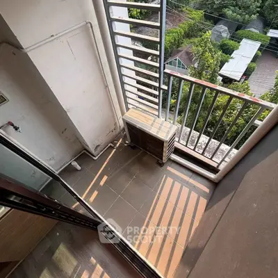 Compact balcony with air conditioning unit and scenic view