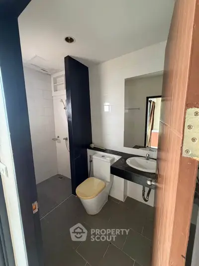 Modern bathroom with sleek design and minimalist fixtures in a contemporary home.