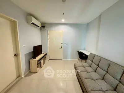 Modern living room with sleek furniture and air conditioning