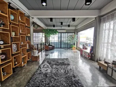 Spacious modern living room with large windows and stylish decor