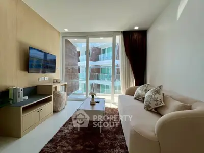 Modern living room with cozy sofa and balcony view in luxury apartment