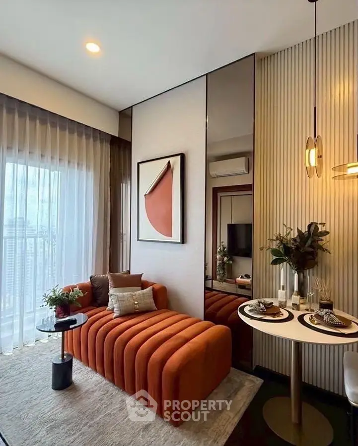 Stylish modern living room with chic orange sofa and elegant dining setup.