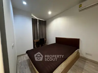 Cozy bedroom with modern furnishings and natural light, perfect for restful nights.