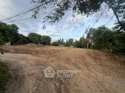 Expansive land plot ready for development in a serene natural setting.