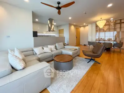 Spacious modern living room with elegant decor and open kitchen layout