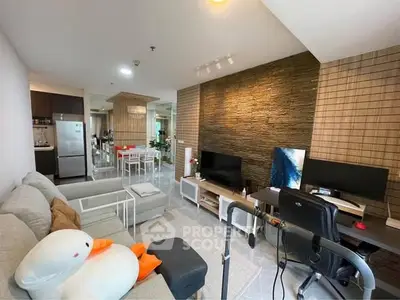 Modern living room with open layout, stylish decor, and cozy ambiance in a contemporary apartment.