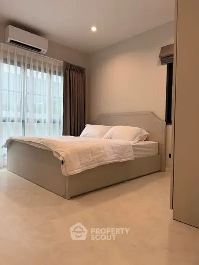 Modern bedroom with elegant decor and natural light