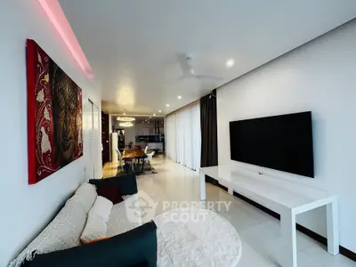 Modern living room with sleek decor and wall-mounted TV